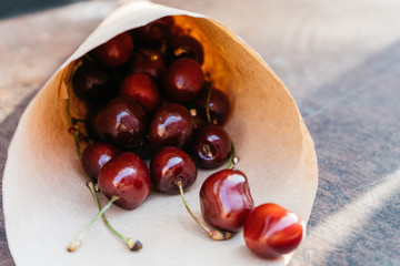 Fresh cherries in paper bag