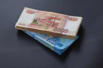 Russian money, packs of Russian banknotes of five thousand and two thousand rubles. Place for text