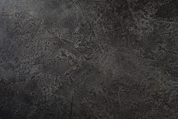 Dark background, black stone