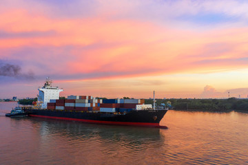 Container ship in export and import business and logistics. Shipping cargo to harbor by crane....