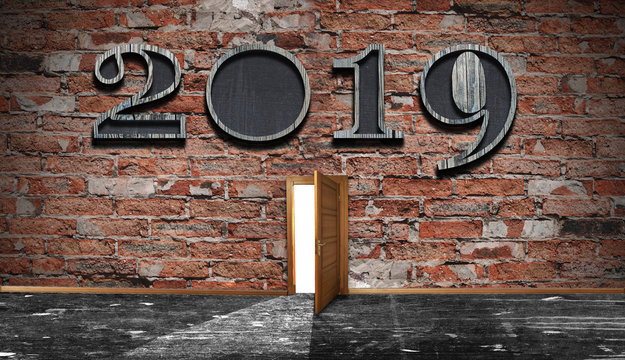 new year celebrattion concept. 2019 sign on dark brick wall. Front view. Can be used for background.