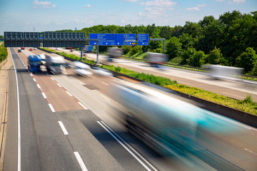 Autobahn highway with blurred trucks Frankfurt Germany - obrazy, fototapety, plakaty