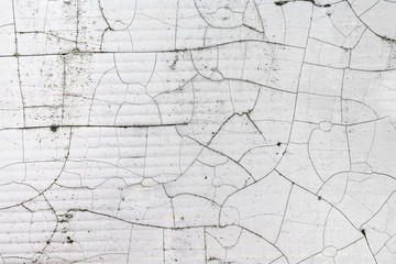 Crack texture of white leather, abstract background.