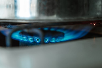 Gas stove, lit a blue flame burner