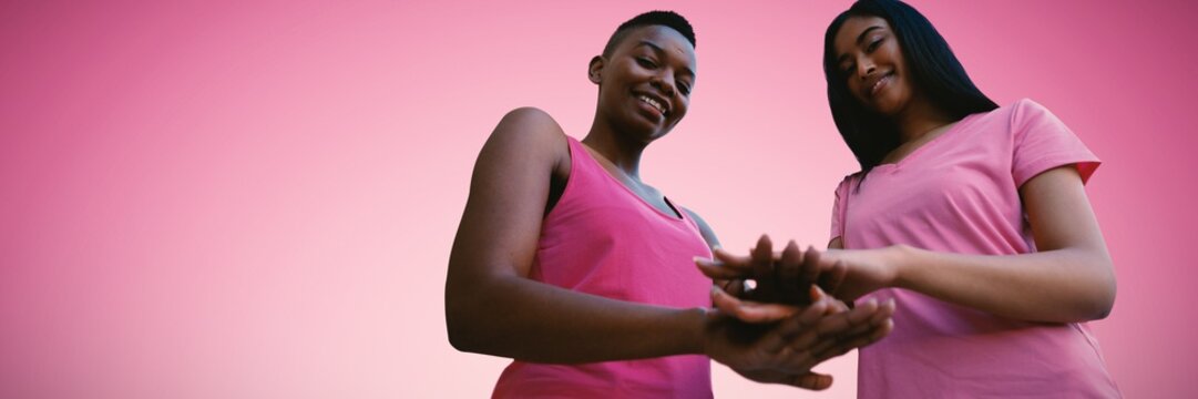 Composite Image Of Two Black Women Joining Hands