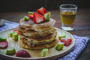 pancake strawberry avocado fruit and honey syrup sweet dessert on wood table pan cake dessert...