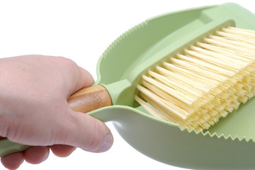 Green dustpan and natural bamboo broom set isolated on white background
