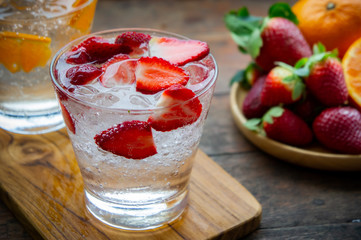 sweet fruits beverage strawberry soda and orange soda cold drink vitamin fruit, tasty drinks on wood table.