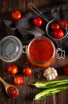 tomato sauce ketchup homemade food kitchen wooden background
