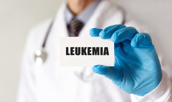 Doctor holding a card with text LEUKEMIA, Medical concept
