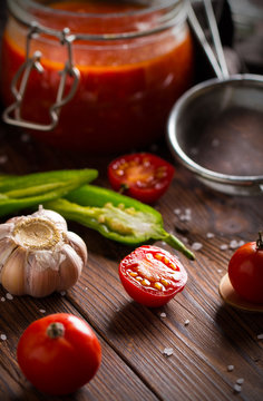 tomato sauce ketchup homemade food kitchen wooden background
