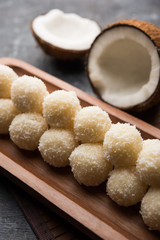 Coconut Sweet Laddoo OR Nariyal Ladduis a Popular Festival food from India. Served over moody background, selective focus