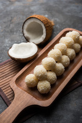 Coconut Sweet Laddoo OR Nariyal Ladduis a Popular Festival food from India. Served over moody background, selective focus