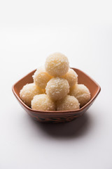 Coconut Sweet Laddoo OR Nariyal Ladduis a Popular Festival food from India. Served over moody background, selective focus