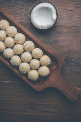 Coconut Sweet Laddoo OR Nariyal Ladduis a Popular Festival food from India. Served over moody background, selective focus