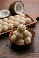 Coconut Sweet Laddoo OR Nariyal Ladduis a Popular Festival food from India. Served over moody background, selective focus