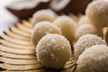 Coconut Sweet Laddoo OR Nariyal Ladduis a Popular Festival food from India. Served over moody background, selective focus