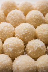 Coconut Sweet Laddoo OR Nariyal Ladduis a Popular Festival food from India. Served over moody background, selective focus