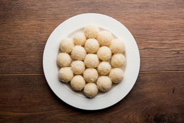 Coconut Sweet Laddoo OR Nariyal Ladduis a Popular Festival food from India. Served over moody background, selective focus