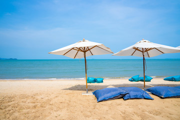 Blue chairs and Umbrella or tent  on beach lounge of hotel resort , Pattaya city, Chonburi,Thailand tropical countries.Vacation holidays background wallpaper concept
