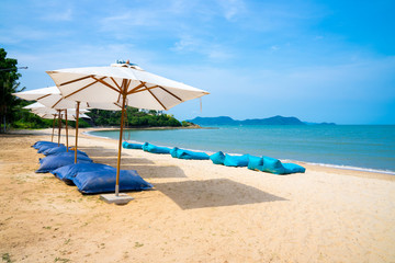 Blue chairs and Umbrella or tent  on beach lounge of hotel resort , Pattaya city, Chonburi,Thailand tropical countries.Vacation holidays background wallpaper concept