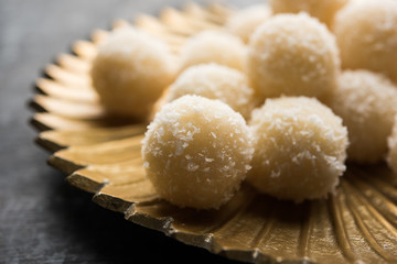 Coconut Sweet Laddoo OR Nariyal Ladduis a Popular Festival food from India. Served over moody background, selective focus