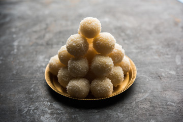 Coconut Sweet Laddoo OR Nariyal Ladduis a Popular Festival food from India. Served over moody background, selective focus