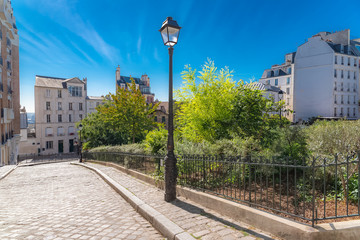 Montmartre, a very romantic parisian street with a vintage lamppost 