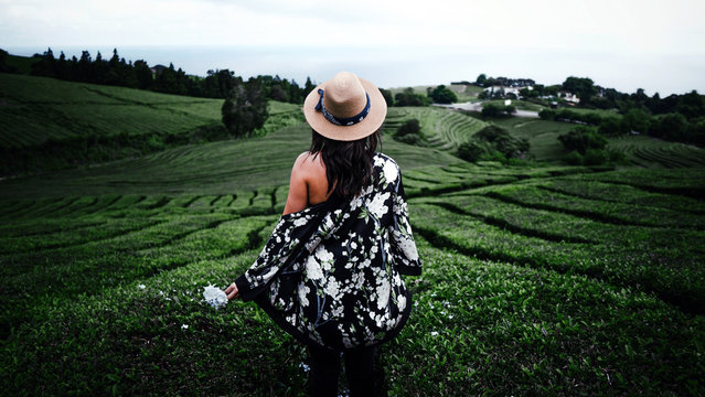 young woman in hat in azores tea field