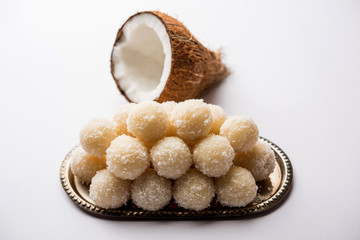 Coconut Sweet Laddoo OR Nariyal Ladduis a Popular Festival food from India. Served over moody background, selective focus