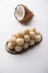 Coconut Sweet Laddoo OR Nariyal Ladduis a Popular Festival food from India. Served over moody background, selective focus