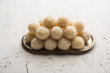 Coconut Sweet Laddoo OR Nariyal Ladduis a Popular Festival food from India. Served over moody background, selective focus