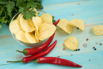 Potato chips with spicy in a glass bowl