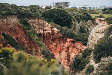 Sandstone limestone rocks of reddish color in Portugal