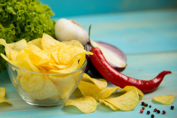 Fototapeta na wymiar Potato chips with spicy in a glass bowl
