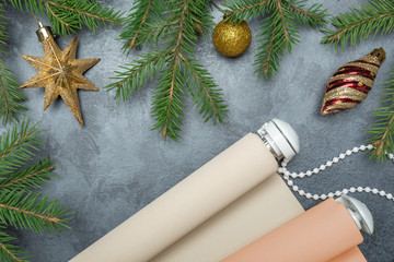 The rolled color shutters is on a concrete background. Color roller blinds lie on gray background. ...