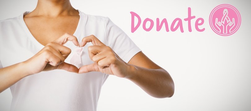 Composite image of graphic image of donate text with breast