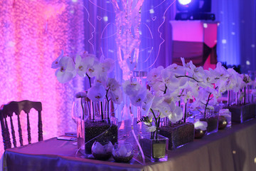 Wedding table flower decoration. Orchid bouquet. Restaurant ,Glamorous Event, celebration