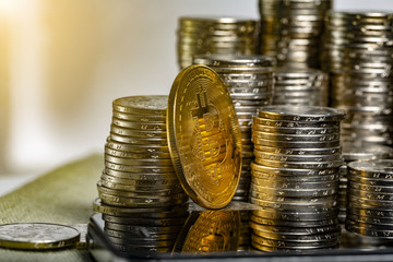 Pile of stacked coins money and crypto bitcoins, Selective Focused. Financial and macro economics concept, top down angle shooting, macro photography.