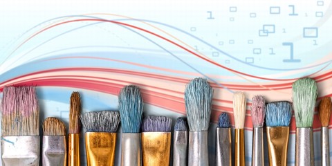 Row of artist paint brushes  on background