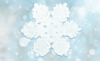 Blue background with snow flakes. Christmas holiday. New Year.