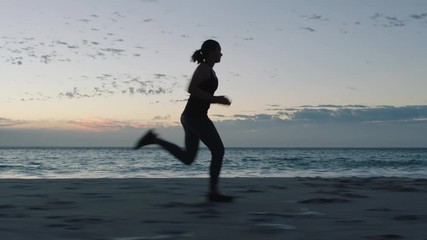 fit young woman athlete running overtaking in race competition female runners training intense cardio workout on beach at sunset