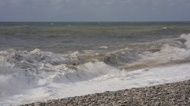 Sea surf. Waves runs on coastal pebble. Georgia, Kvariati