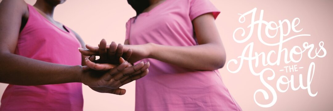Composite image of two black women joining hands