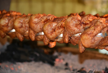 Many chicken grill with vintage style machine in restaurant at Austria.