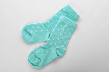 Cute child socks on white background, top view