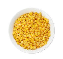 Bowl with corn kernels on white background, top view