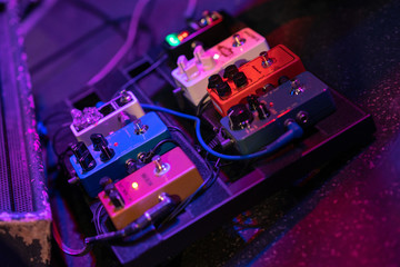 Fototapeta premium Close up of pedal board on stage