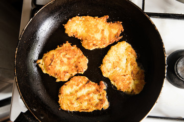 Fried potato pancakes on pan. Traditional Polish dish
