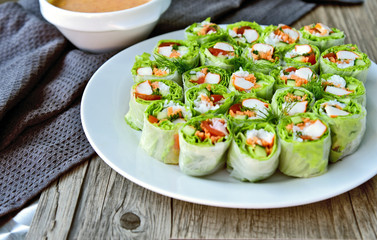 Salad roll with peanut spicy sauce healthy food menu..Mixed Vegetables wrapped with rice noodles and sauce.